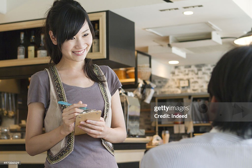 30th generation man and 20th generation woman who are at a café