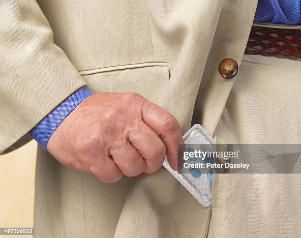 sexually active senior with viagra - hands in pockets foto e immagini stock