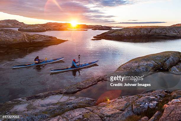 paddlers in sunrise - archipelago ストックフォトと画像