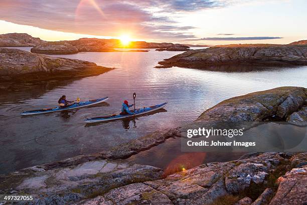 paddlers in sunrise - archipelago stock pictures, royalty-free photos & images