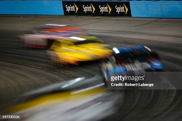 View of race action during the NASCAR Sprint Cup Series Quicken Loans Race for Heroes 500 at Phoenix International Raceway on November 15, 2015 in...