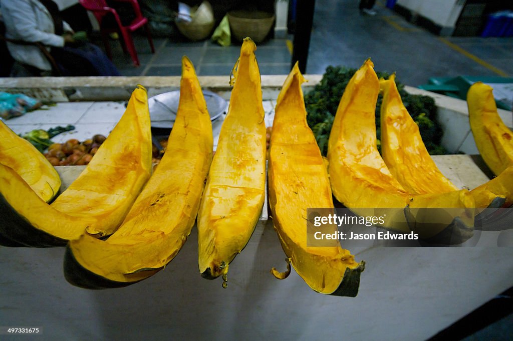 Fresh, healthy and organic pumpkin wedges for sale in a Himalayan farmers market.