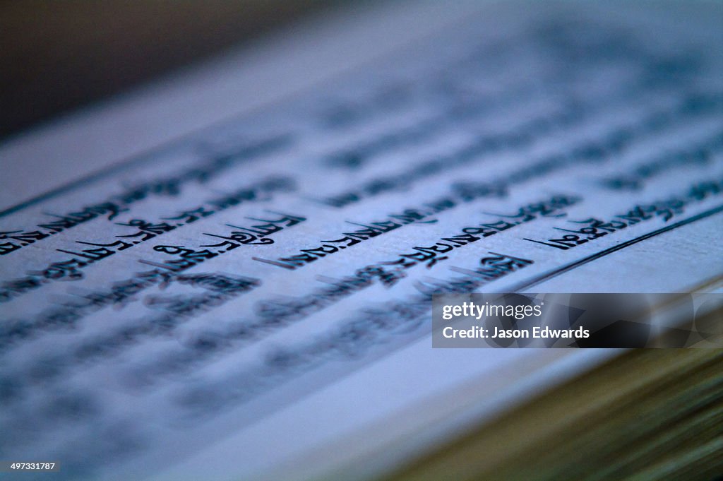 Ancient sanskrit text on the parchment of a Buddhist monk performing a death ceremony.