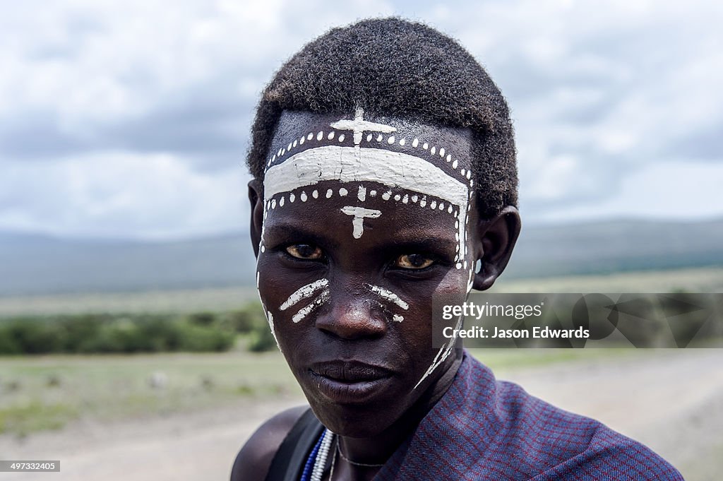 A teenage Maasai warrior, a Moran, with his facial markings elaborately painted.