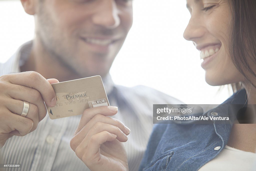 Couple preparing to make credit card purchase