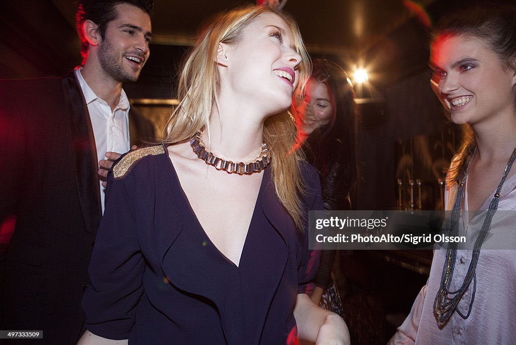 Young woman partying with friends