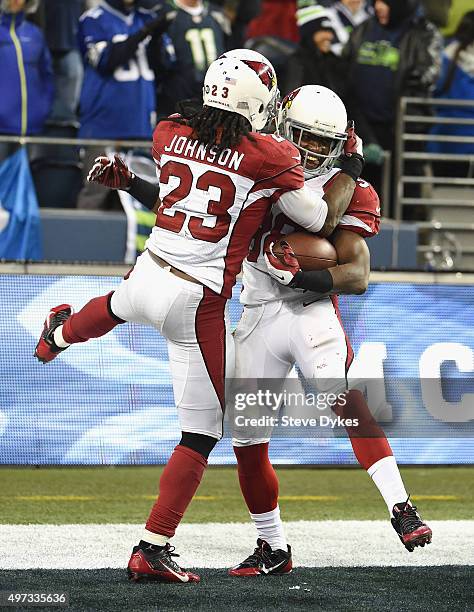 Andre Ellington of the Arizona Cardinals celebrates with Chris Johnson of the Arizona Cardinals in the end zone after rushing for a 48-yard touchdown...