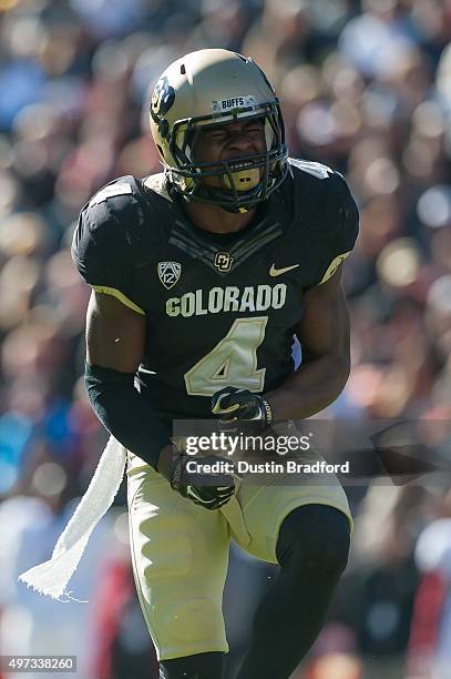 Defensive back Chidobe Awuzie of the Colorado Buffaloes celebrates a defensive stop against the Stanford Cardinal at Folsom Field on November 7, 2015...