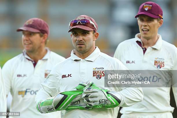 Chris Hartley of the Bulls leaves the ground at the end of play on day three of the Sheffield Shield match between the Queensland Bulls and South...