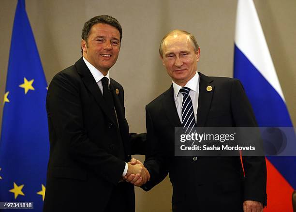 Russian President Vladimir Putin and Italian Prime Minister Matteo Renzi attend a bilateral meeting during the G20 Antalya Summit on November 16,...