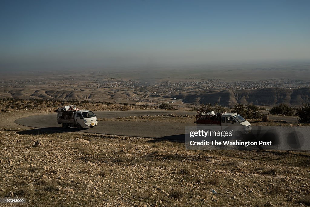 SINJAR, NOVEMBER 14: Trucks filled with appliances are seen dri