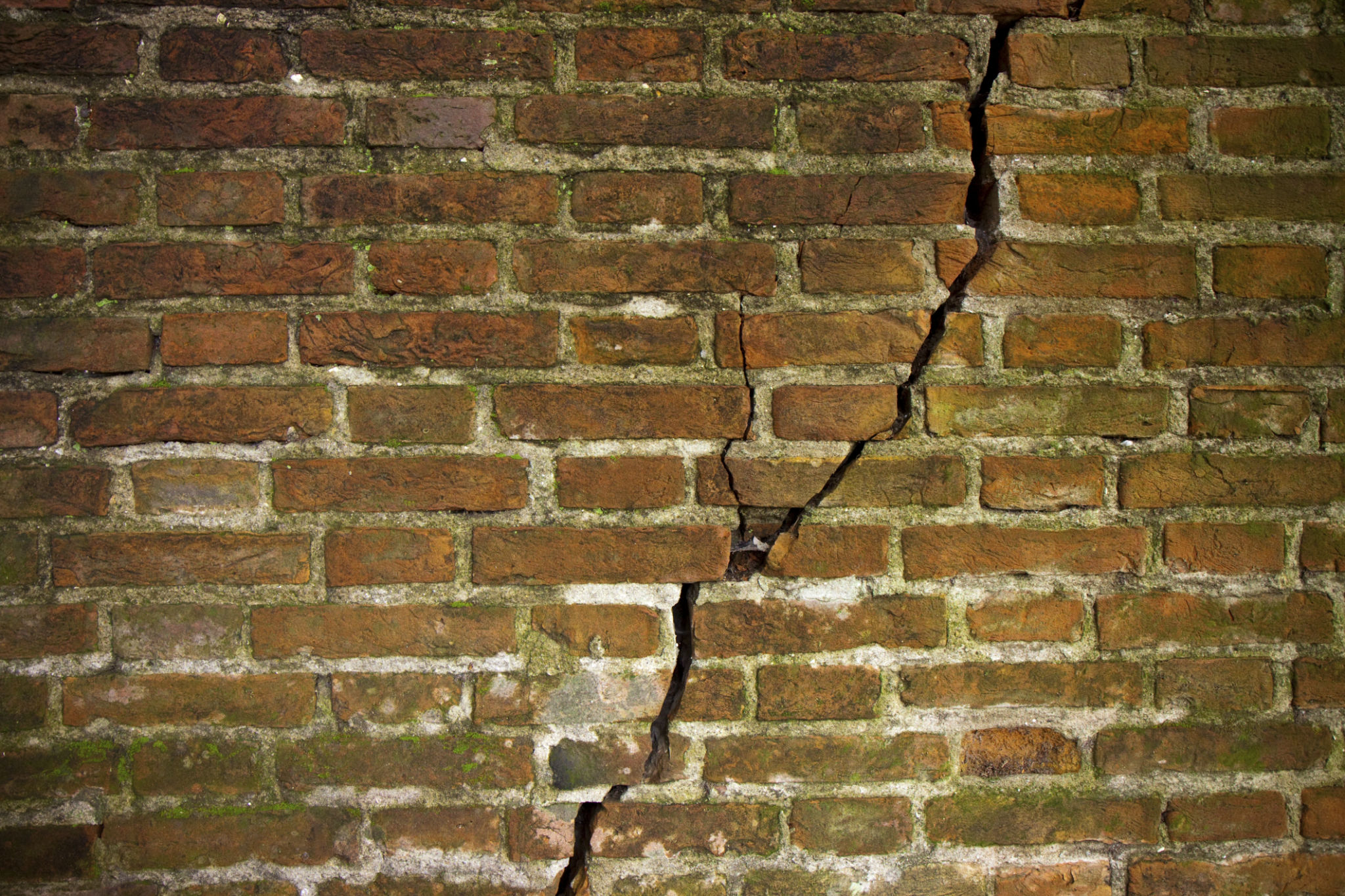 Cracked brick wall Cracked brick wall
