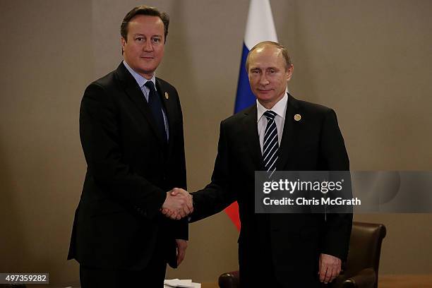 British Prime Minister David Cameron and Russian President Vladimir Putin pose for a photograph during their bilateral meeting on day two of the G20...