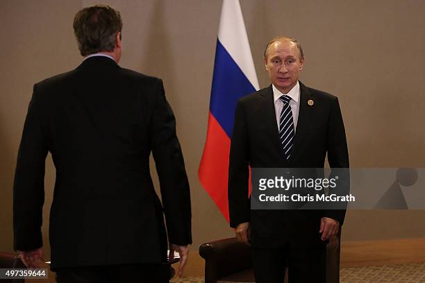 British Prime Minister David Cameron arrives to meet Russian President Vladimir Putin during their bilateral meeting on day two of the G20 Turkey...