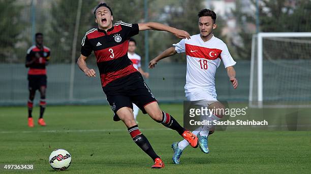 Dominik Franke of Germany is tackled by Volkan Egri of Turkey during the U18 four nations friendly tournament match between Turkey and Germany at...