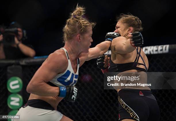 Holly Holm punches Ronda Rousey in their UFC women's bantamweight championship bout during the UFC 193 event at Etihad Stadium on November 15, 2015...