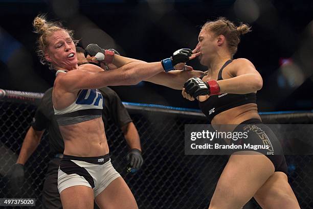 Ronda Rousey punches Holly Holm in their UFC women's bantamweight championship bout during the UFC 193 event at Etihad Stadium on November 15, 2015...