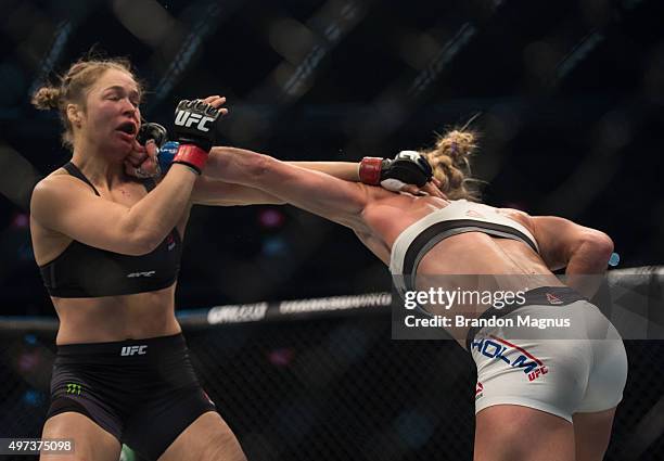 Holly Holm punches Ronda Rousey in their UFC women's bantamweight championship bout during the UFC 193 event at Etihad Stadium on November 15, 2015...