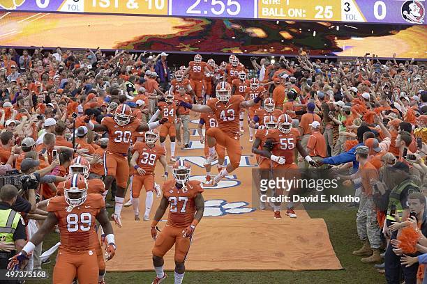 Clemson Chad Smith running down the hill while taking field with teammates before game vs Florida State at Clemson Memorial Stadium. Smith in mid...