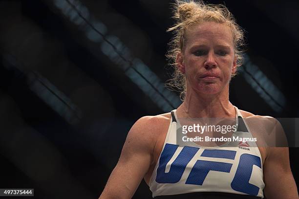 Holly Holm heads to her corner after the first round while facing Ronda Rousey in their UFC women's bantamweight championship bout during the UFC 193...