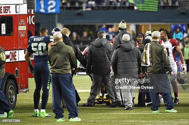 Mike Iupati of the Arizona Cardinals is taken off the field after suffering an apparent injury during the first half against the Seattle Seahawks at...