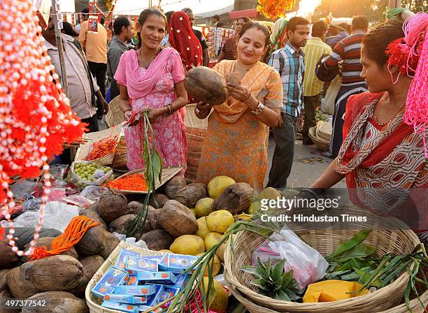 People buying puja ingredients for the upcoming Chhath Puja at Geeta Colony, on November 16, 2015 in New Delhi, India. The Goddess who is worshipped...