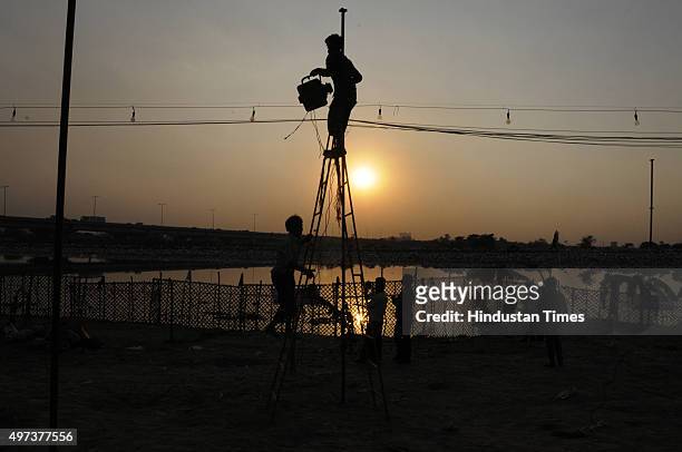 People preparing for the Chhath festival at Geeta Colony, on November 16, 2015 in New Delhi, India. The Goddess who is worshipped during the famous...
