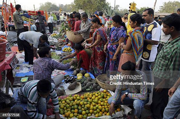 People buying puja ingredients for the upcoming Chhath Puja at Geeta Colony, on November 16, 2015 in New Delhi, India. The Goddess who is worshipped...
