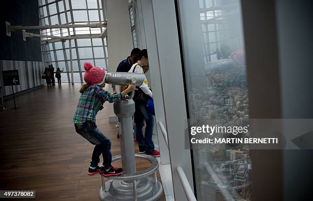 People visit the lookout of the Costanera Center tower in Santiago on November 16, 2015. The Costanera Cernter has the highest lookout in South...