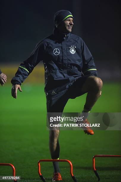 Germany's Thomas Mueller warms up during a training session on the eve of the friendly football match Germany vs The Netherlands in Barsinghausen,...