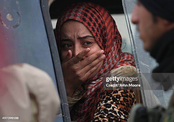 Woman from an Arabic family cries after her family was rejected to enter a Kurdish-controlled area from an ISIS-held village on November 16, 2015...