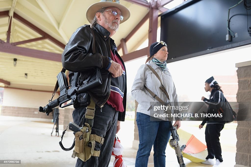 Gun Rights Parade Open carry gun activists participate in a march down South Florissant ...