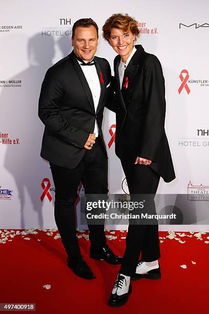 Guido Maria Kretschmer and Bettina Boettinger attend the Artists Against Aids Gala 2015 at Stage Theater des Westens on November 16, 2015 in Berlin,...