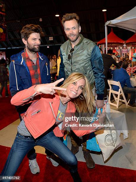 Actress Cindy Ambuehl photo bombs actors Adam Scott and Joel McHale as they attend Express Yourself 2015 to benefit P.S. ARTS, providing arts...