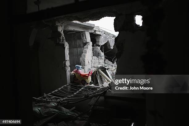 Child's toy lay in the rubble of a home destroyed by an airstrike on November 16, 2015 in Sinjar, Iraq. Kurdish forces, with the aid of months of...