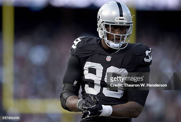 Aldon Smith of the Oakland Raiders looks on during a timeout against the Minnesota Vikings in the third quarter of their NFL football game at O.co...