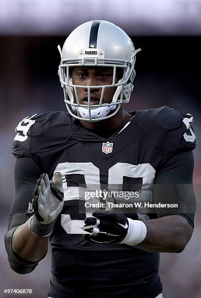 Aldon Smith of the Oakland Raiders looks on during a timeout against the Minnesota Vikings in the third quarter of their NFL football game at O.co...