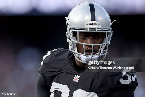 Aldon Smith of the Oakland Raiders looks on during a timeout against the Minnesota Vikings in the third quarter of their NFL football game at O.co...