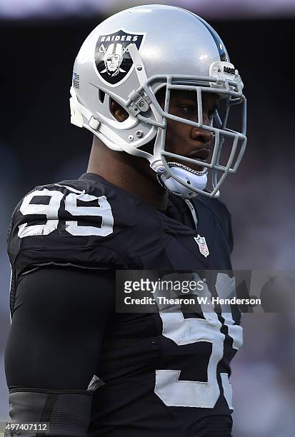Aldon Smith of the Oakland Raiders looks on during a timeout against the Minnesota Vikings in the third quarter of their NFL football game at O.co...