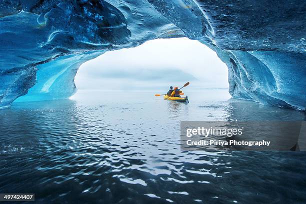 kayak in ice cave - kayak stock-fotos und bilder