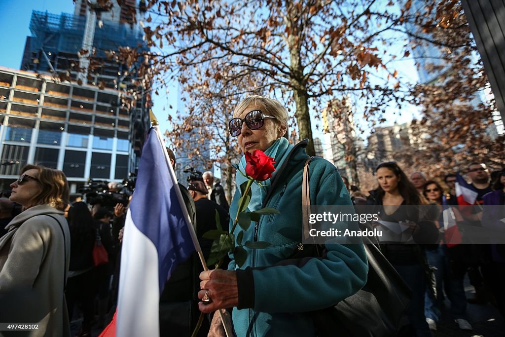 Gathering under the Survivor Tree for Paris terror attacks victims