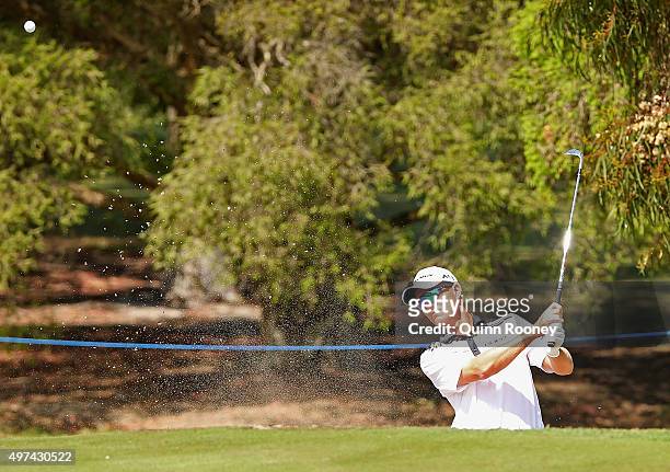 John Senden of Australia plays out of the bunker during a practice round ahead of the 2015 Australian Masters at Huntingdale Golf Course on November...