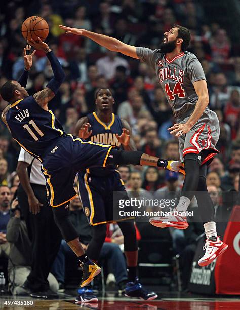 Nikola Mirotic of the Chicago Bulls tries to block a shot by Monta Ellis of the Indiana Pacers at the United Center on November 16, 2015 in Chicago,...