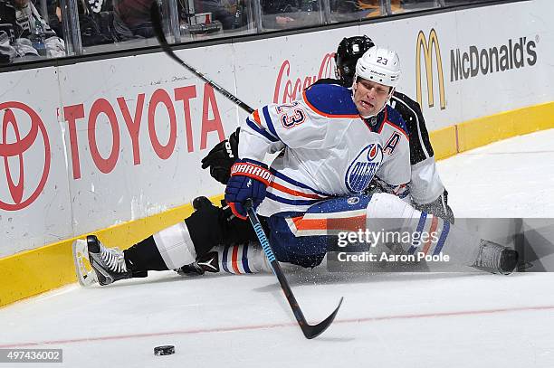 Matt Hendricks of the Edmonton Oilers battles for the puck during a game against the Los Angeles Kings at STAPLES Center on November 14, 2015 in Los...