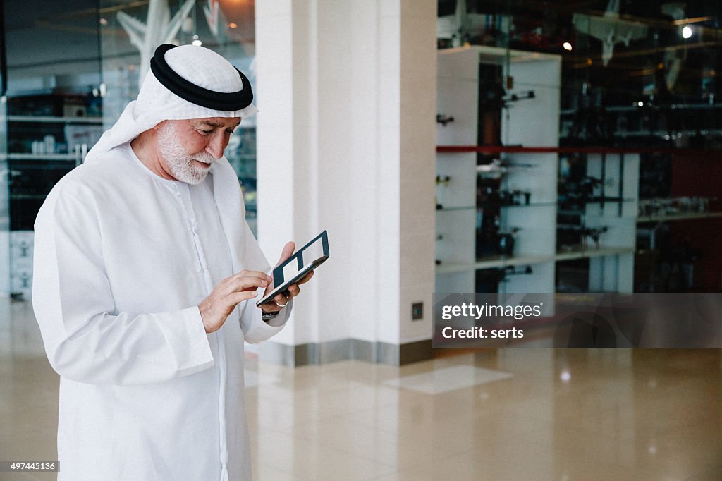 Senior Arabian Man with cellphone