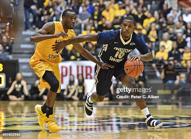 Guard Danny Upchurch of the Charleston Southern Buccaneers brings the ball up field against guard guard Ty Taylor of the Wichita State Shockers...