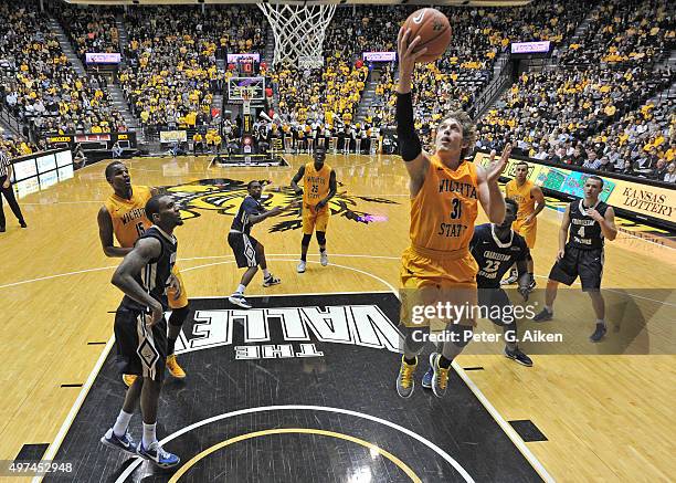 Guard Ron Baker of the Wichita State Shockers drives in for a score against the Charleston Southern Buccaneers during the second half on November 13,...