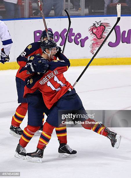 Nick Bjugstad is congratulated by Jonathan Huberdeau of the Florida Panthers after scoring the game winning goal during a game against the Tampa Bay...