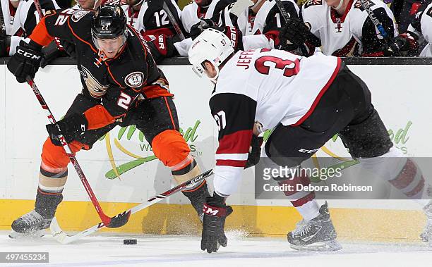 Shawn Horcoff of the Anaheim Ducks gets pressure along the boards from Dustin Jeffrey of the Arizona Coyotes on November 9, 2015 at Honda Center in...
