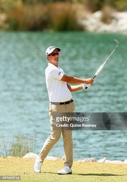Adam Scott of Australia plays an approach shot during a practice round ahead of the 2015 Australian Masters at Huntingdale Golf Course on November...